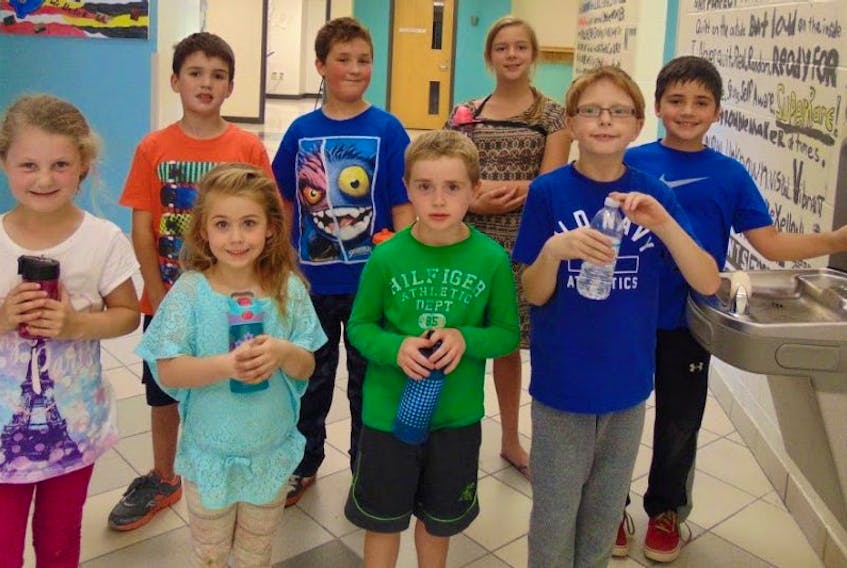 Pictured are Riverside Elementary School students in Albert Bridge as they line up to fill their water bottles. Front row, Sophie Lilly, Myra Boone, Lochlain O'Neil and Daniel Dicks; back row, Jackson Lahey, Austin Wadden, Baileigh MacDonald and Ayden Ball, who is filling is water bottle at a refillable water bottle station.