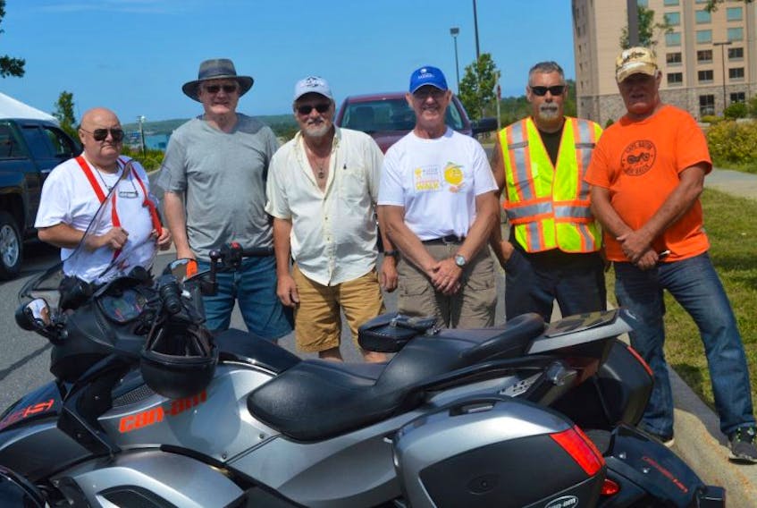 From left, organizers, Lloyd Sheppard, David Campbell, Ken Markotjohn, Greg Whyte, Mike Basso and Kerry MacLellan get ready to set up for the 2017 Cape Breton Bike Rally on Thursday.