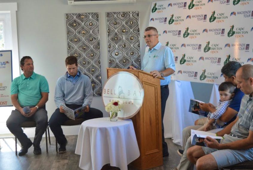 Sandy Campbell speaks at a news conference for the Cape Breton Open on Thursday in Baddeck as players. Left to right, golfers Pat DeCoste, Brad Curren, Peter Campbell and Trevor Chow, sit at the front of the room.