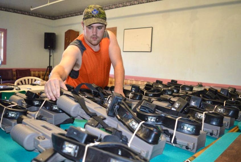 Jeff Knarr, president of the Glace Bay Y’s Men’s and Women’s Club, gets laser tag guns ready for the opening of a laser tag arena at the club hall on Commercial Street in Glace Bay earlier this week. Knarr said the club’s laser tag is one of the most advanced systems on the island.