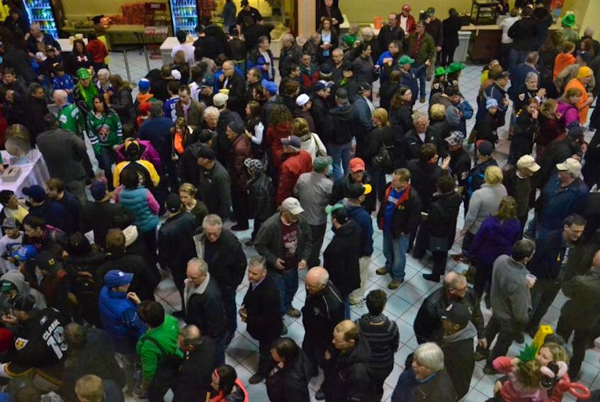 Crowds of people fill the main concourse at Centre 200 during the intermission of a Cape Breton Screaming Eagles game. Outside food or beverages are no longer permitted in the arena.