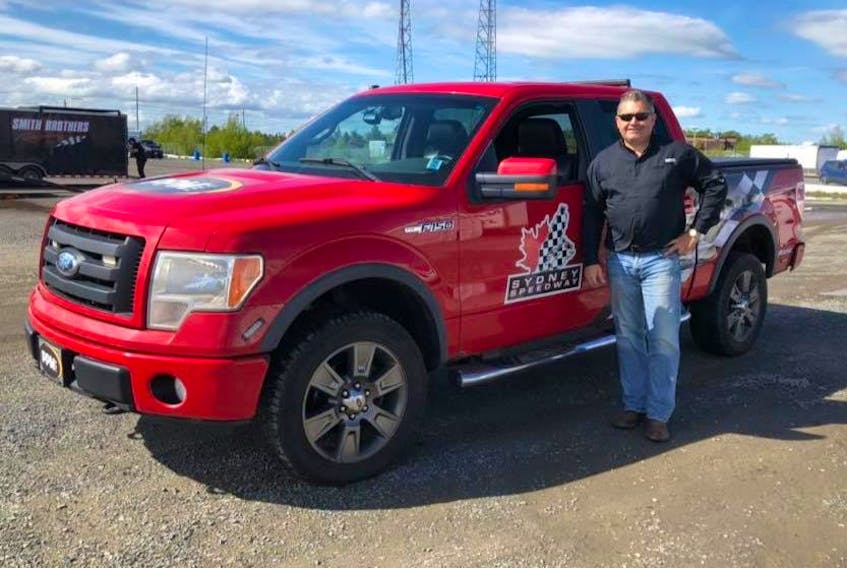 Sydney Speedway owner Greg Dowe poses next to their new pace truck. After sitting idle for the past two years, the track set to reopen with a two-day show July 27 and 28. Contributed