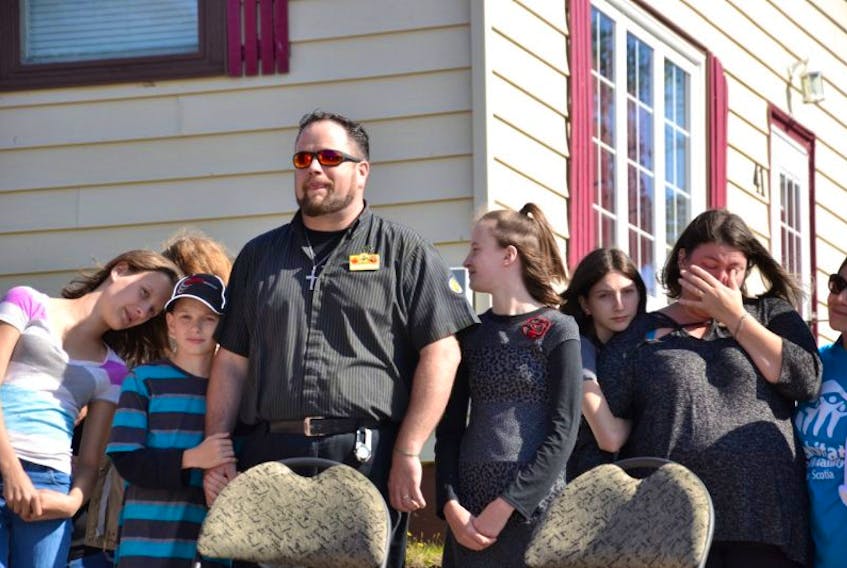 The McLean family shared an emotional moment waiting to get the keys to their new home from the Cape Breton chapter of Habitat for Humanity. From left, Chelsea, Dallas, dad Jason, Angelina, Jocelyn and mom Ann.