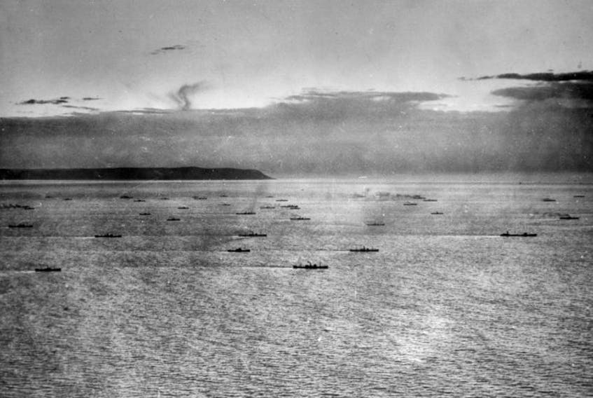 A convoy of 37 ships leaves Sydney harbour in 1942, on its way to the British Isles. In the background is northern Cape Breton and Cape North.
