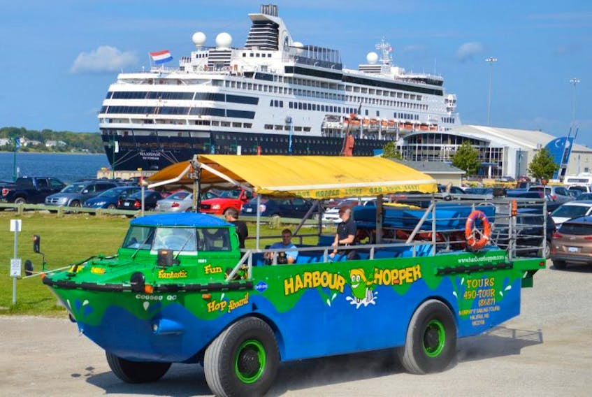 The amphibious Harbour Hopper tour bus/boat, shown here with the Maasdam cruise ship in the background, will hit Sydney streets and the harbour on Sunday when the new tourism initiative begins a two-month trial run in Cape Breton. The tour’s operator is confident the service will be offered next year from May through October.