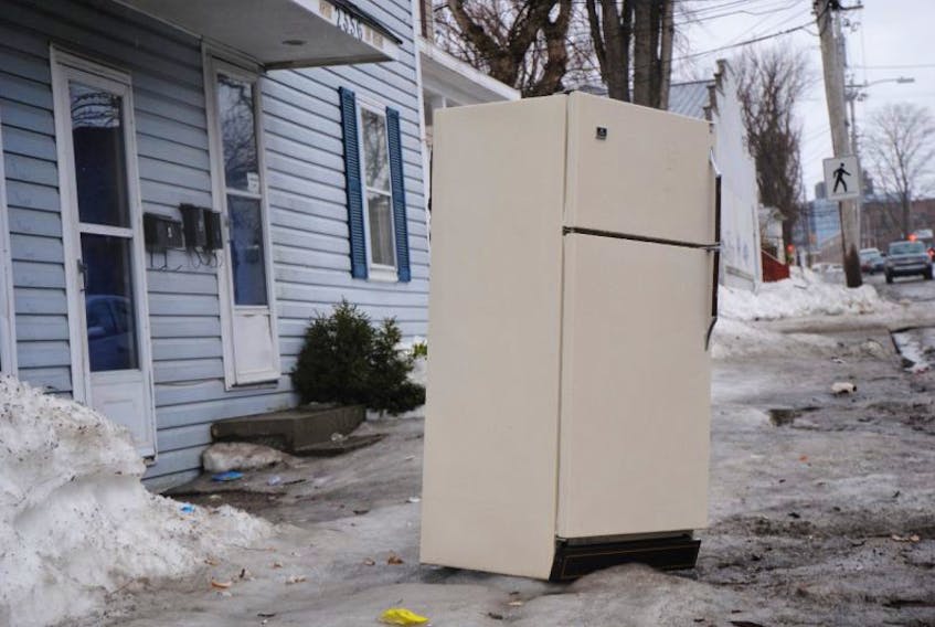 Household appliances like this refrigerator shown in this file photo will be included in the heavy garbage pickup that begins on May 1.