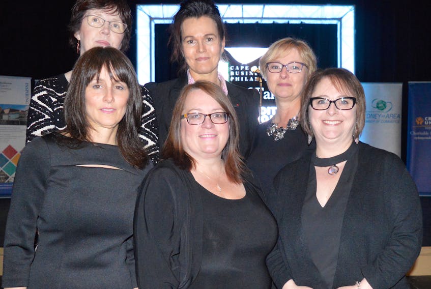 Members of 100 Women Who Care CBRM, front from left, Shelley Bennett Trifos, Shelley Lund and Deana Lloy, and back from left, Margie Moore, Dianne Beauchesne and Rose Westbury pose for a photo at the Cape Breton Business and Philanthropy Hall of Fame dinner and awards in May 2017. The group, which has donated more than $150,000 to a dozen local charities, won the group or event of the year award at the gala.
