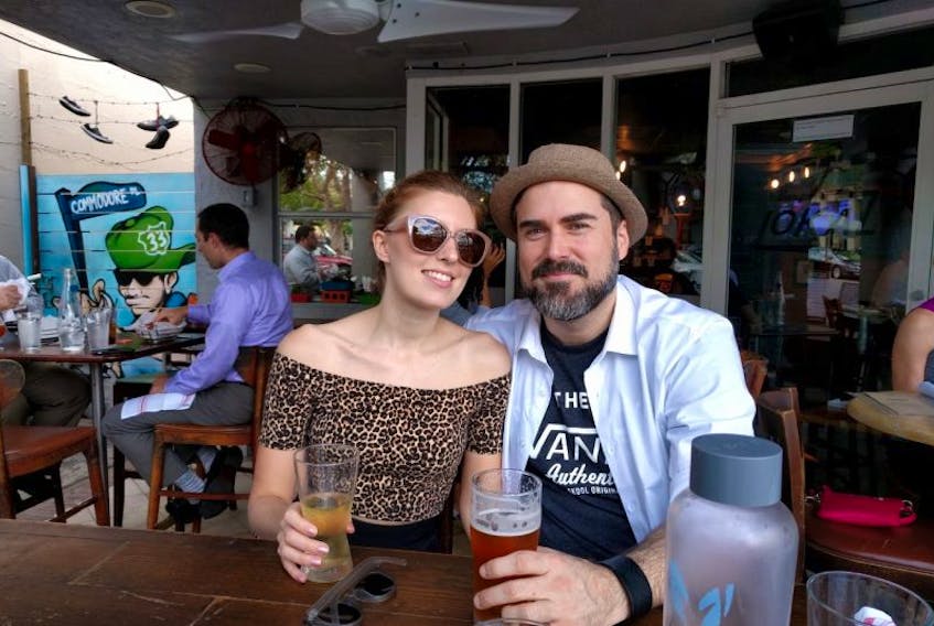Cape Breton native Angela La Muse and her husband, Alex DiMella, enjoy drinks on a patio before hurricane Irma caused them to evacuate their apartment in Coconut Grove, Florida.