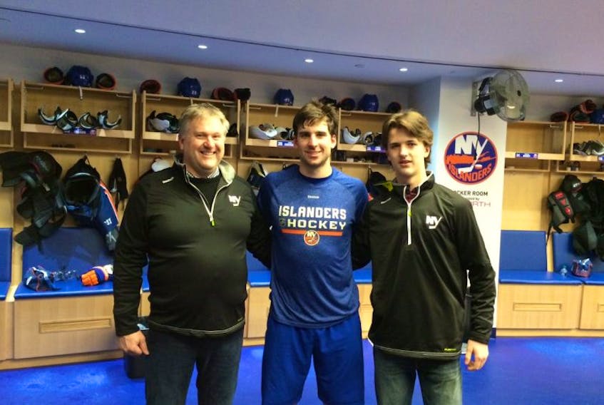 JP Morris, left, and his son Jack, right, are pictured with John Tavares of the New York Islanders following the Islanders game against the Washington Capitals on Jan. 31 in New York. The Morris’ won a trip to New York to see the Islanders play through a fundraiser in support of the Wear Well Bombers major bantam hockey team.