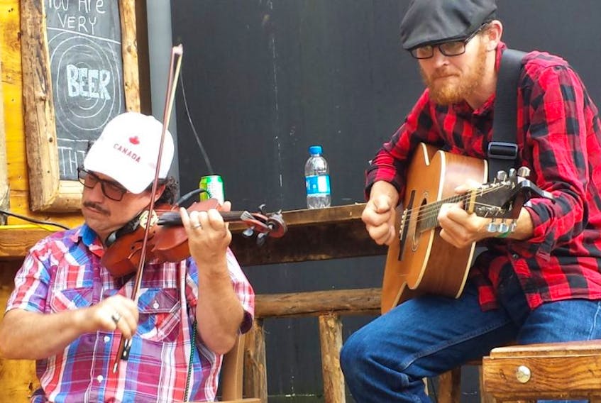 Dwayne Côté and Jason MacDonald performed recently on Governor’s street-level deck in downtown Sydney.