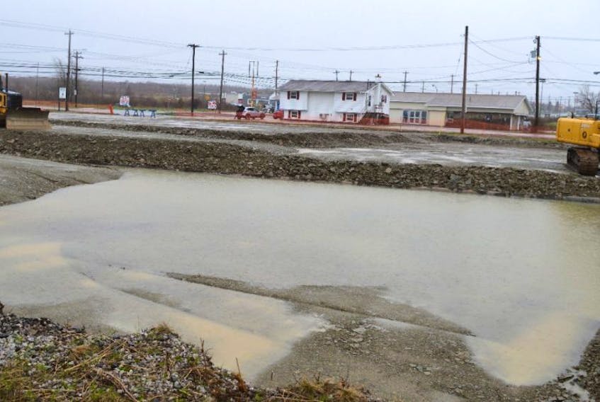 Despite the rain, equipment from Yates Trucking and Excavation remains in place at the site of the new Tim Hortons on Reserve Street, Glace Bay. Yates Construction has been levelling the ground in preparation for construction of the new coffee shop which is expected to start Monday.
