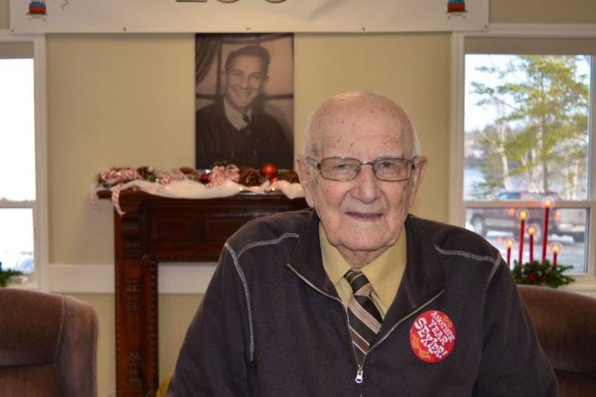 George Carabin stands for a picture during his 100th birthday celebration at the Union Memorial Hall in Albert Bridge on Saturday. Carabin, a longtime resident of Mira, turned 100 years old on Friday.
