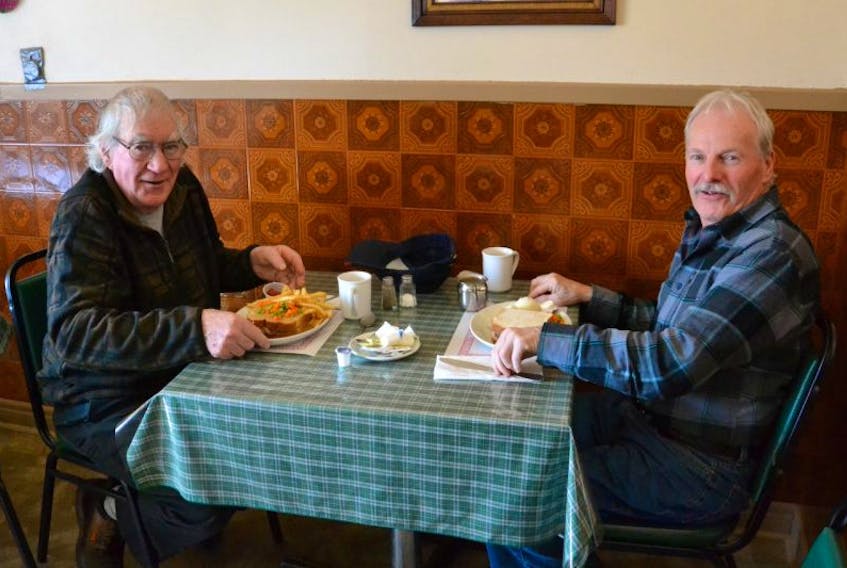 After learning that Vi’s Restaurant is set to close on Saturday after 59 years of business, Lewis MacLellan, left, and Andrew Tate drove from Antigonish to have one last meal at the popular Whycocomagh eatery.