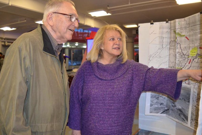 Eileen Lannon-Oldford, CEO of Business Cape Breton, and Ron MacDonald are shown looking at a display during the Atlantic Memorial Park community presentation at the Joan Harriss Cruise Pavilion in Sydney on Thursday. The presentation explained plans for the proposed park in Sydney Mines.
