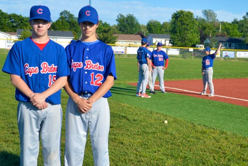 Cape Breton Cubs players Ethan Conrad, left, and Kendall MacQueen pose for a photo Tuesday at Susan McEachern Memorial Ball Park in Sydney. The Cubs head to Calgary next week to represent Team Atlantic at the Canadian Senior Little League Championship.