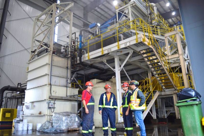 Employees of Kameron Collieries at the Donkin Mine inside the wash plant which is now operational including, from left, electrician Ted McRury of New Victoria, wash plant supervisor Scott Roberts formerly of British Columbia and now of Cape Breton, plant operator Eric Steylen of Mira and vice president of project development and external affairs Shannon Campbell. The wash plant is now going through the commissioning process.