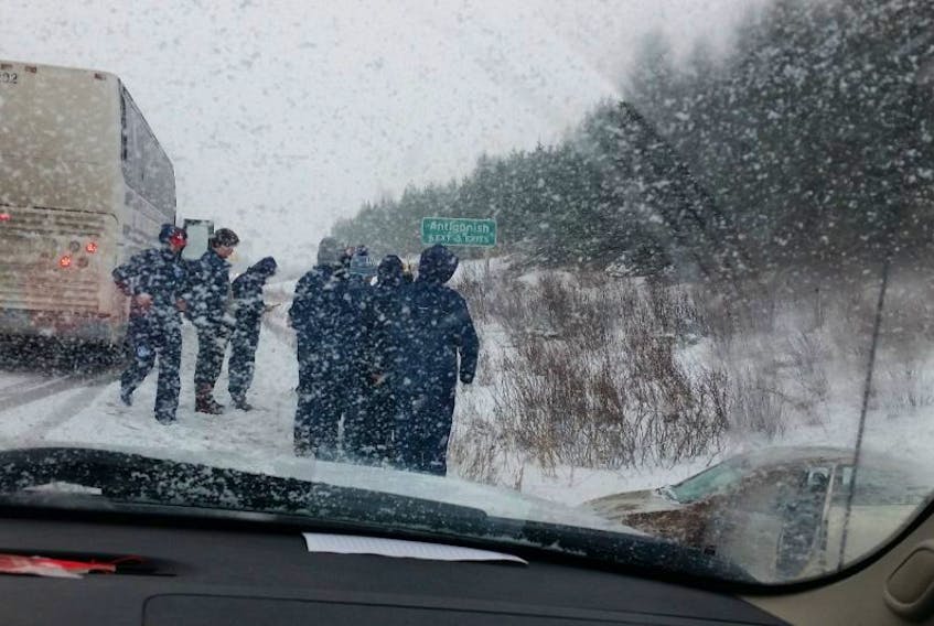Cape Breton Unionized Tradesmen players and their coaches helped accident victims Amanda Confiant of Dutch Brook and her young son, Kobi Hillier, along the side of the road just outside of Antigonish on Sunday.