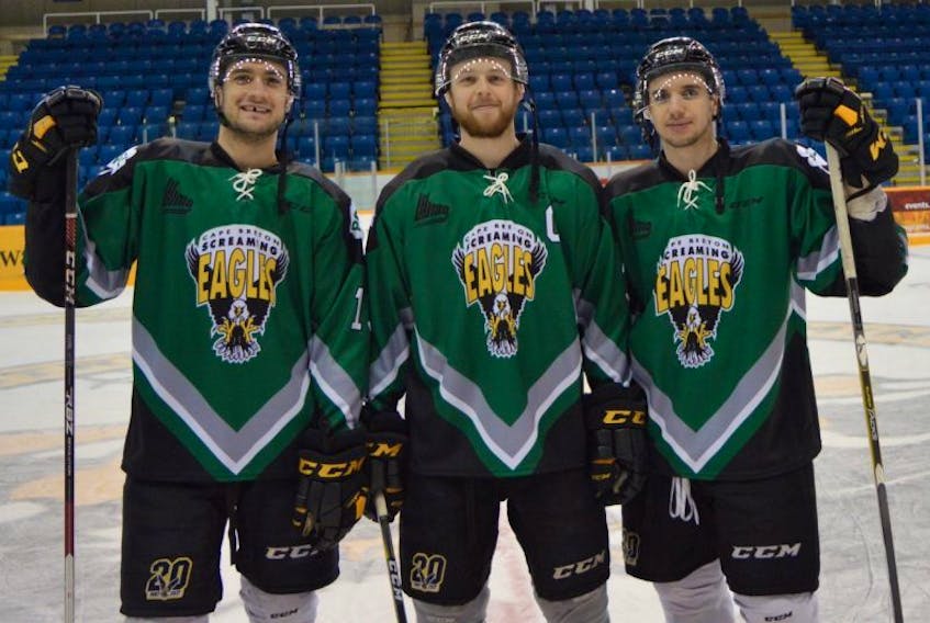 Giovanni Fiore, from left, Olivier LeBlanc and Massimo Carozza model the special jerseys the team will wear during tonight’s game against the Acadie-Bathurst Titan at Centre 200. The annual fundraiser in memory of former team president Greg Lynch, has contributed more than $120,000 to the Cape Breton Regional Hospital Foundation since 2007.