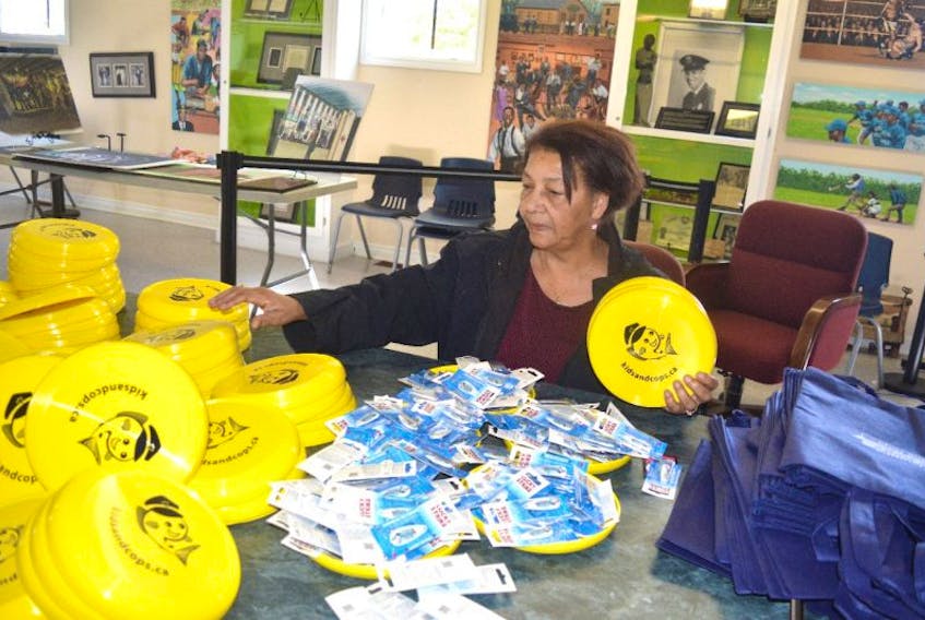 Theresa Brewster, chair of the Glace Bay Universal Negro Improvement Association, prepares gift bags for children who will participate in the association’s 11th annual fishing derby on Saturday at the John Bernard Croak Memorial Park in Glace Bay. Pre-registration is required.