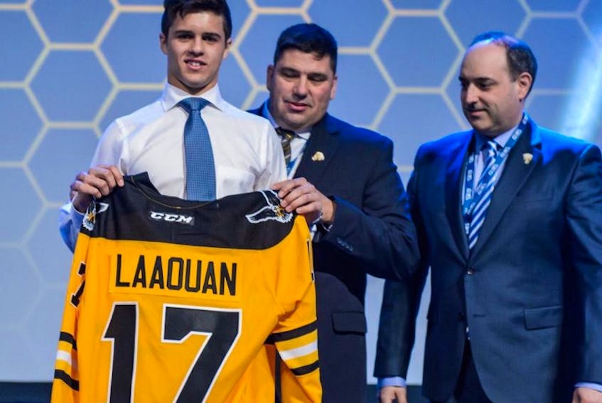 Cape Breton Screaming Eagles top pick Noah Laaouan, from left, is presented with his jersey by team staff Jacques Carrière and Marc-André Dumont after the club selected the 15-year-old No. 14 overall at the 2017 QMJHL Entry Draft in Saint John, N.B., in June.