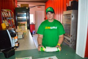 Emily Pelley, pictured, is helping her parents Kelly-Anne and James Pelley manage their nine newly acquired Subway franchises in the Cape Breton Regional Municipality, as well as the booth they have set up this week at the Cape Breton County Exhibition. The Pelleys purchased the outlets from longtime owner Kirk MacRae.