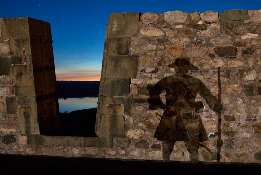 A re-enactor’s shadow is seen on a stone wall at the Fortress of Louisbourg. The reconstructed 18th-century French fortress is the most haunted place in Cape Breton, according to local paranormal investigator Doug Mombourquette of Haunts from the Cape. Contributed/Fortress of Louisbourg National Historic Site