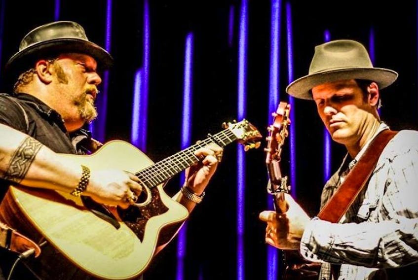 Left to right, J.P Cormier and Dave Gunning are seen here playing guitar together. They will perform at the second annual Cape Breton Guitar Night next month in Sydney.