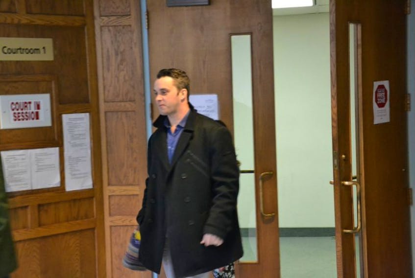 Arson accused Gary Richard Luker, 32, leaves a Sydney courtroom Tuesday and is to return to court in February to enter pleas. He is among three former firefighters charged with arson.