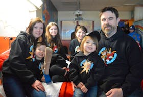 The family of Caleb MacArthur sits on a bed in a newly renovated room, known as Caleb’s Courage Superhero Suite, in the pediatrics unit at the Cape Breton Regional Hospital in Sydney. The family has been fundraising since 2015 to make the room a reality in memory of Caleb. From left, Nicole Forgeron, Emery MacArthur, Ella MacArthur, Aubreigh MacArthur, Lauchlin MacArthur and Mike MacArthur.