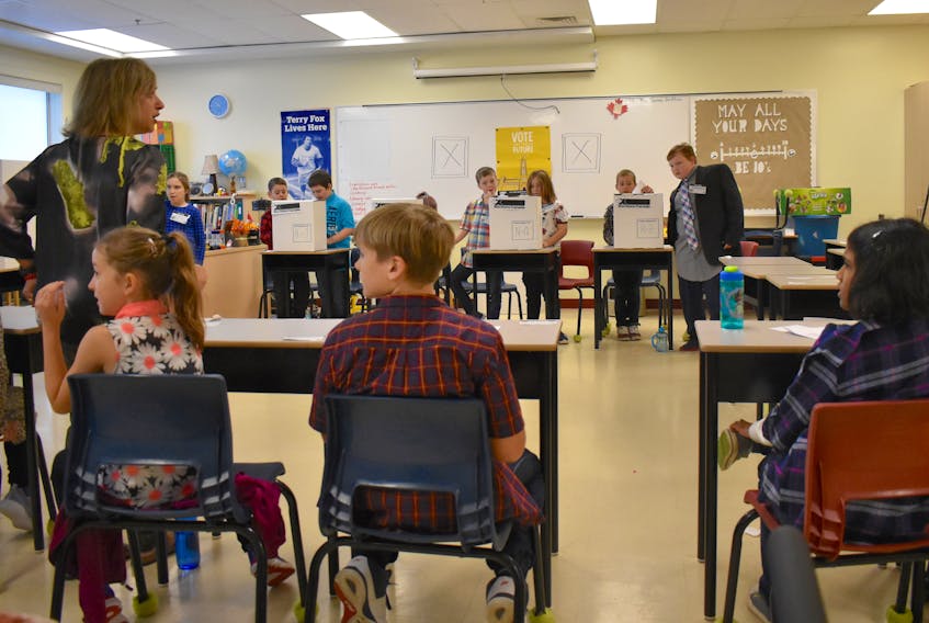 Teacher Neeta Kumar-Britten talks to her Grade 4 students before they staged a mock election on Thursday.