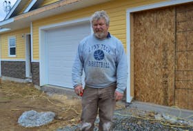 Contractor Ronnie MacKinnon is working at the site on Brown Street in Sydney where a new duplex is under construction. Developer Ray Embree says he wouldn’t have proceeded with the build if he realized how large the annual tax bill for the finished product will be.