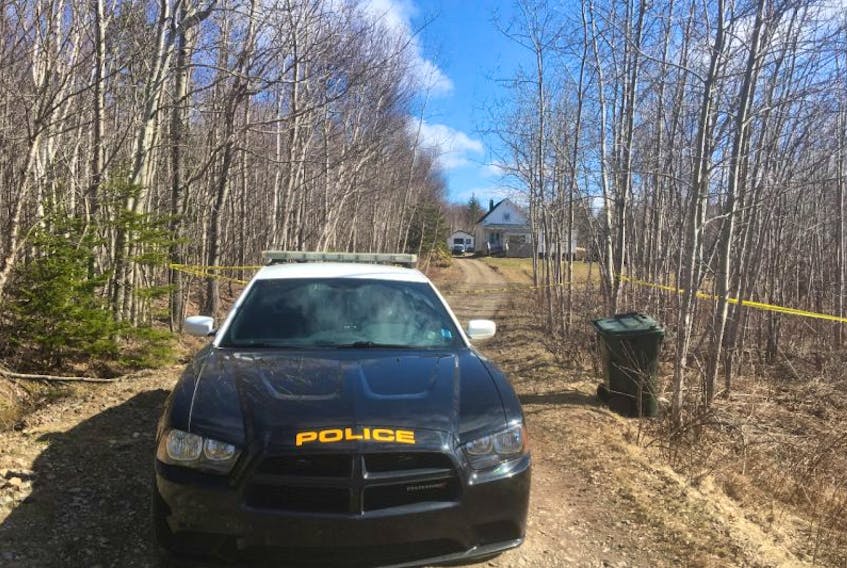 A Cape Breton Regional Police vehicle is stationed outside a house at 87 Obrien St. in Gardiner Mines on Tuesday afternoon. A woman was found dead inside the home at noontime Tuesday, and a man, who was at the scene when police arrived, has been arrested and taken into custody.