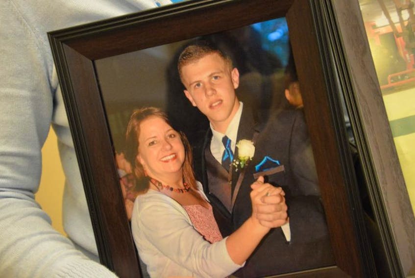 A family photograph shows James Poirier dancing with his mother Debbie Long at his high school graduation. The 19-year-old Port Hawkesbury man died following a single-vehicle crash in 2015 on Route 19 in Newtown.