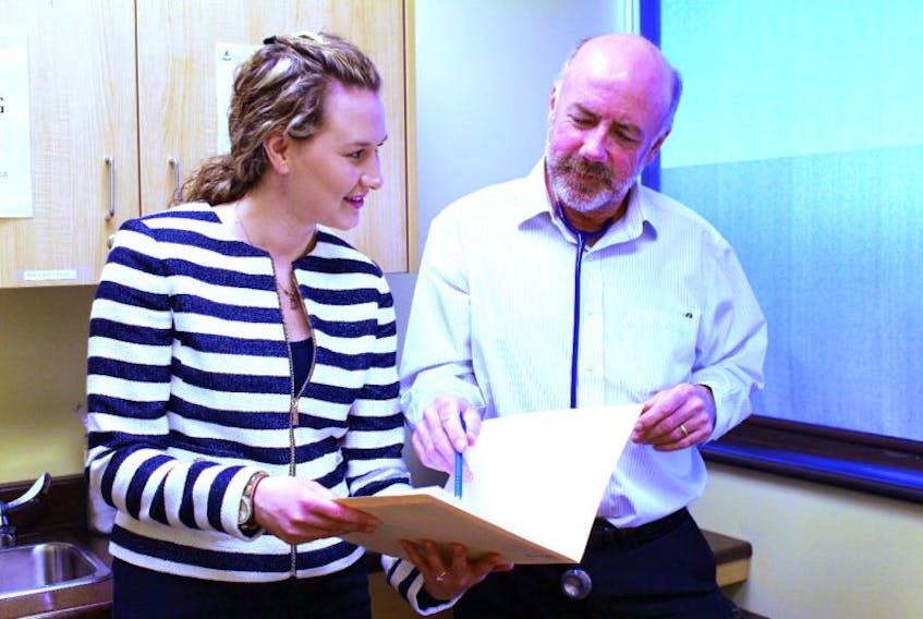 Nurse practitioner Dena Edwards and Dr. Steven MacDougall review a chart at Island Family Health Care in Sydney. Seven new nurses are to be in place in Cape Breton by the end of May.