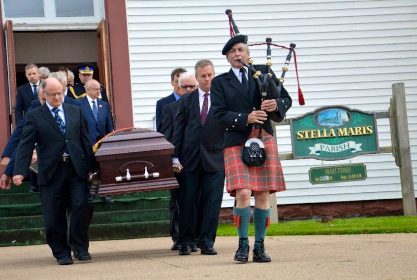 The casket belonging to Allan J. MacEachen was led outside the Stella Maris Parish in Inverness by pallbearers and a traditional piper. The longstanding parliamentarian was remembered with a simple funeral service Tuesday at the same church where he was baptized
