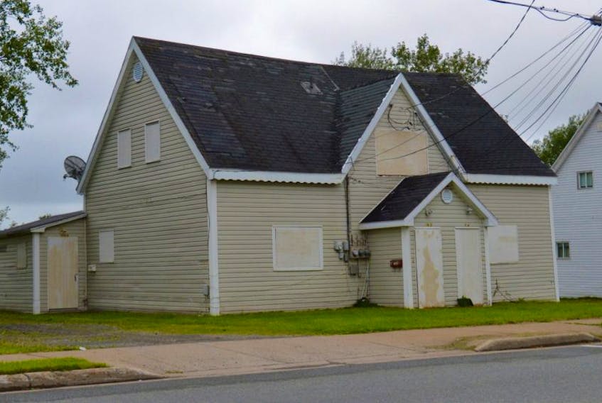 Shown in this file photo is an old company house duplex on Victoria Road in Sydney that is one of almost three-dozen properties slated for demolition after being deemed dangerous and unsightly by the CBRM. Council heard appeals last night from any homeowner opposed to the municipality’s plans.