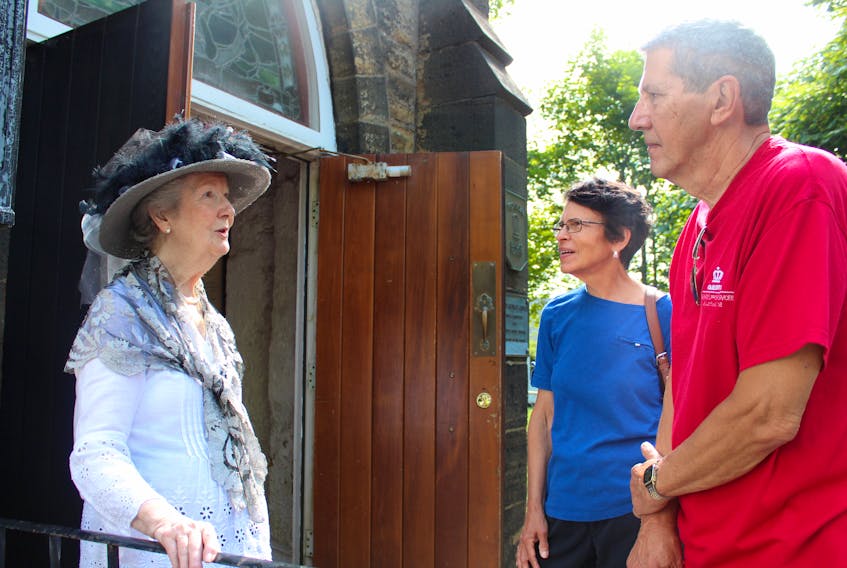 Connie Jennings, from left, a volunteer interpreter at St. George’s Anglican Church, talks to tourists Martha and Bob Went of Cumberland, Rhode Island outside the Charlotte Street church on Tuesday. The Wents were among the passengers on the cruise ship Zaandam who were exploring downtown Sydney. Built in 1785 as the British garrison chapel, St. George’s is believed to be the first permanent structure built in Sydney.