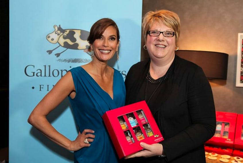 Actress Teri Hatcher, left, is shown with Joanne Schmidt and the Galloping Cows Oscar Box at the 89th Oscar gifting suite. It was the first major marketing milestone for the Port Hood business but it took a toll on Schmidt’s health due to bright lights and loud music.