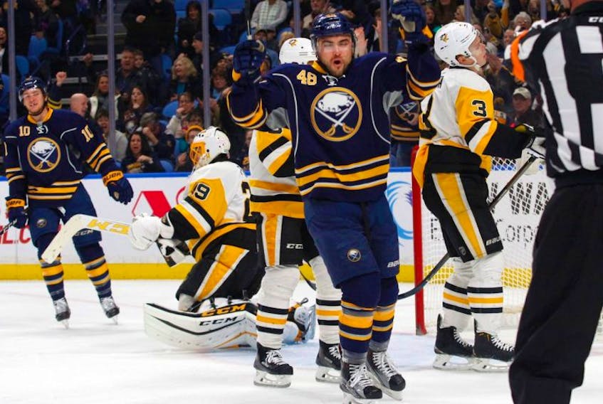 Buffalo Sabres forward William Carrier (48) celebrates his first NHL goal during the first period of a hockey game against the Pittsburgh Penguins, Saturday, Nov. 19, 2016, in Buffalo, N.Y.