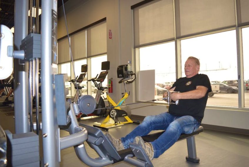 Shelly Ferneyhough works out at the YMCA branch at the Membertou Sport and Wellness Centre on Wednesday. The gym opened at the end of November, however the grand opening was held on Wednesday.