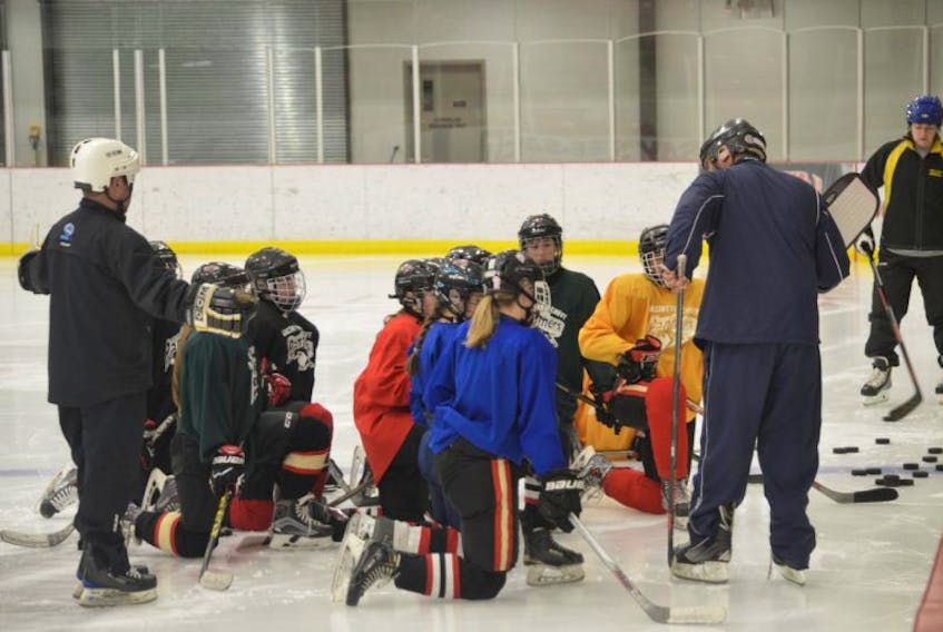 Coach Troy Chiasson talks with his MacIntyre Chevy Panthers female midget hockey team before a practice on Thursday. The Panthers’ first games of the Nova Scotia Female Midget ‘AAA’ Hockey League 2017 season are on Saturday and Sunday against the Northern Lightning in Tracadie-Sheila, New Brunswick.