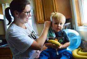 Potlotek mother-of-two Pauline Marshall cleans her 15-month-old son Coby using bottled water after Health Canada recently advised residents to avoid drinking, bathing or even doing laundry in their tap water due to elevated levels of manganese and iron.