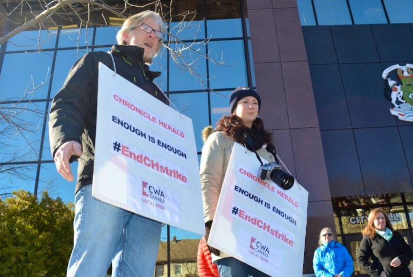 Striking Chronicle Herald workers Tom Ayers and Erin Pottie are shown during Monday’s Day of Protest in front of city hall in Sydney. The rally marked the one-year anniversary of the strike at the Halifax-based newspaper.