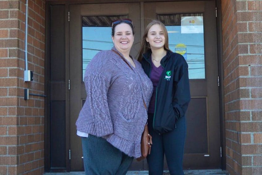 Angela Bruce and daughter Jayla were all smiles after learning that the Southend Community Centre will be moving its programs to its new home at the former Mira Road Elementary School. Fifteen-year-old Jayla has been attending martial arts classes at the centre for almost 10 years.