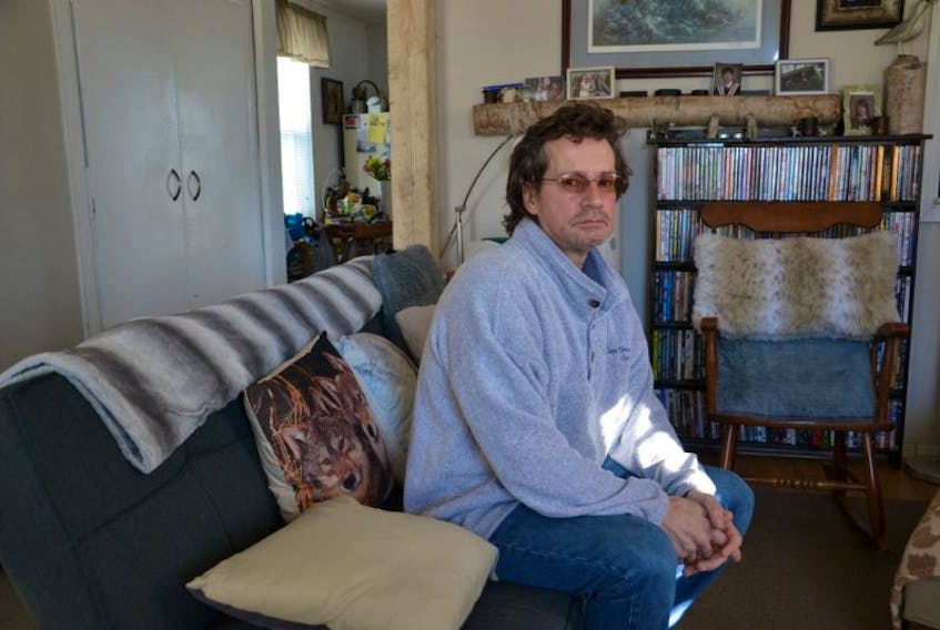An unhappy Joe Yorke sits in the living room of his North Sydney home. Yorke was slammed in the face by an individual who was subsequently charged with aggravated assault. The charge was dismissed as a result of a mix-up over courtrooms.