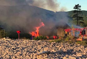 RCMP is investigating after a fire caused severe damage to a Parks Canada building near the Fresh Water Lake Trail in Ingonish Beach. Shown is the fire at the facility early Sunday morning.