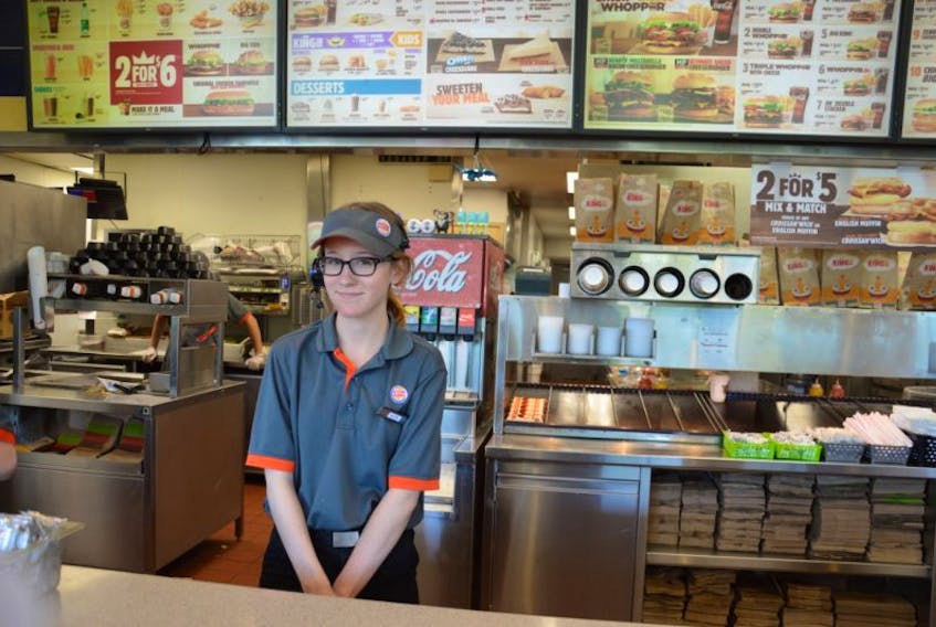 Seventeen-year-old Sydney Academy student Kate Munro is having a busy summer, working full-time as a student heritage interpreter at Fortress of Louisbourg and part-time at Burger King. Being a cashier at Burger King is the high school student’s year-round job.