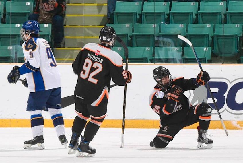 Cheticamp’s Logan Timmons of the Cape Breton West Islanders, right, celebrates a goal with teammate Jacob Hudson at the 2017 Telus Cup national midget hockey championship in Prince George, B.C., Tuesday. Timmons scored twice in a 4-1 win over the Leduc Oil Kings.