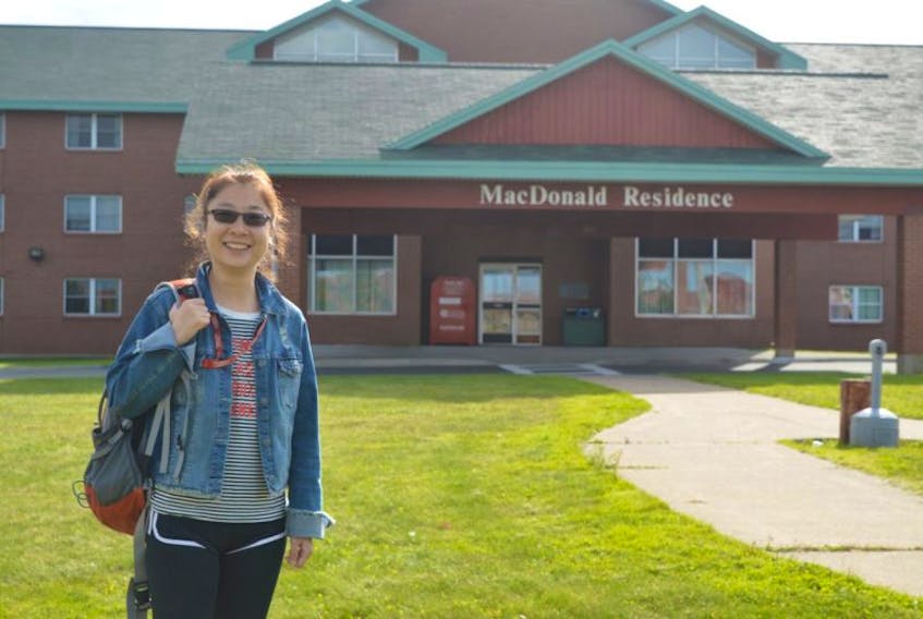 Xin Li, a Chinese national taking the pre-MBA course at ICEAP, stands outside her residence on the CBU campus. Li and two of her classmates were told to speak English and go back to China by a young man outside of the Irving gas station on George Street the first week of September.