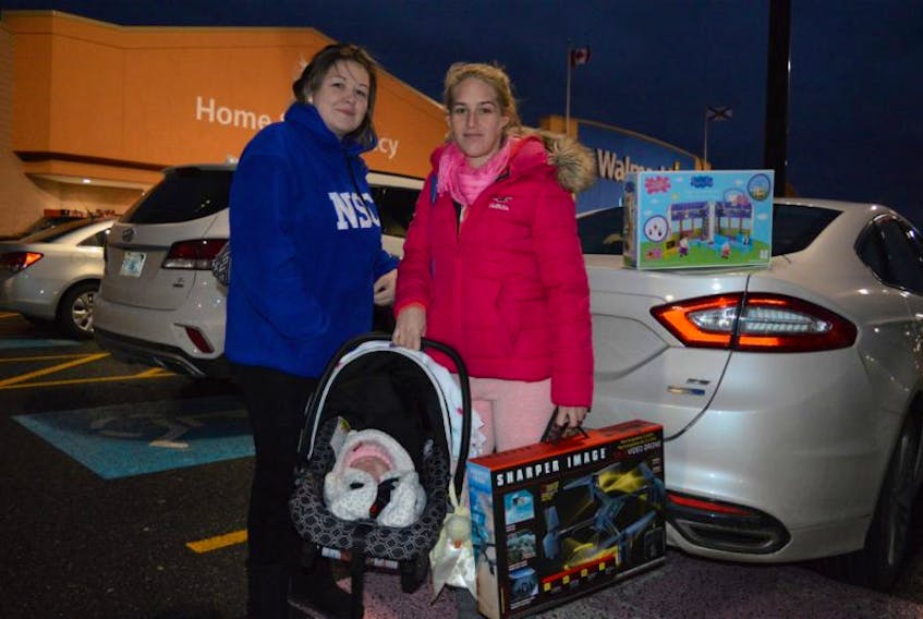 Miranda MacDonald, Ashley Ogley and her daughter Miranda Ogley took in the early Black Friday sales on Friday. They’re shown outside of Walmart on the Sydney Port Access Road just after grabbing some deals.